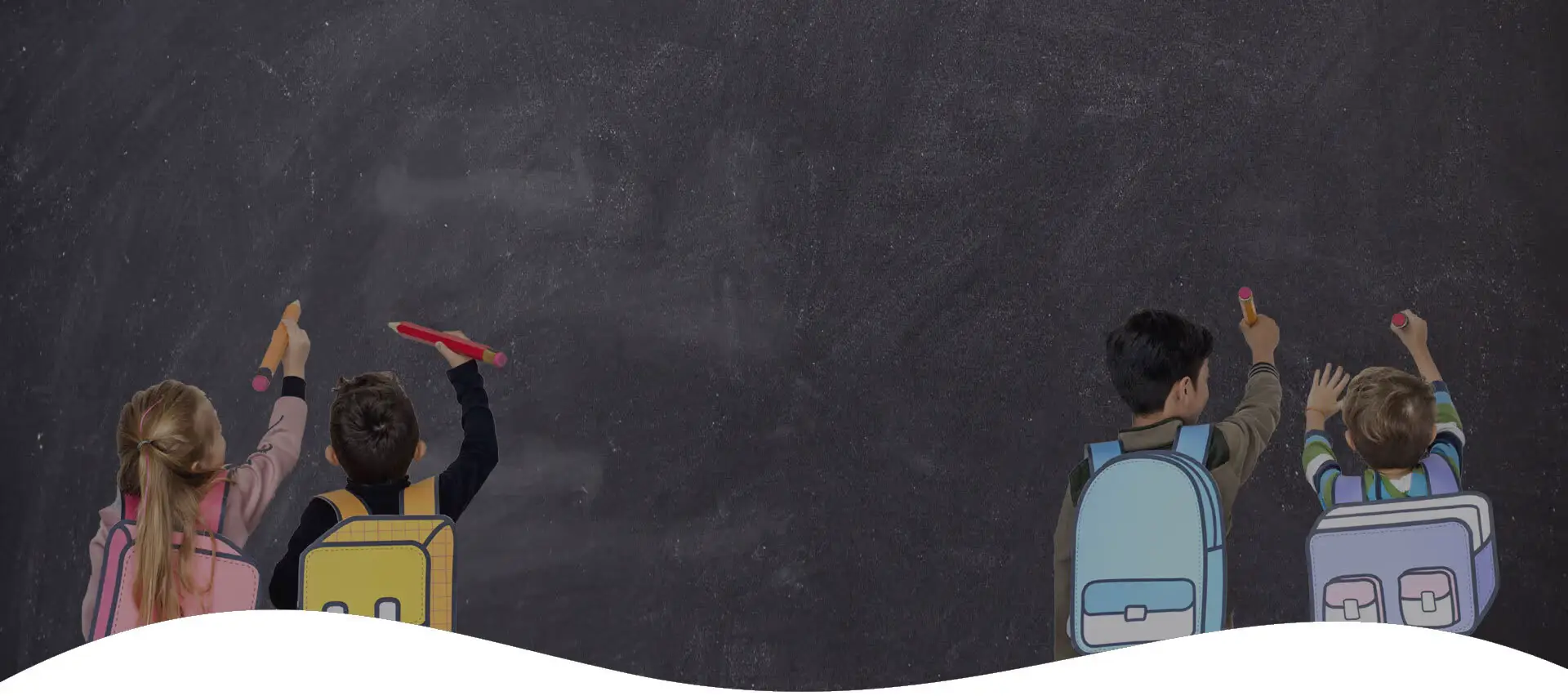 Students drawing on chalkboard